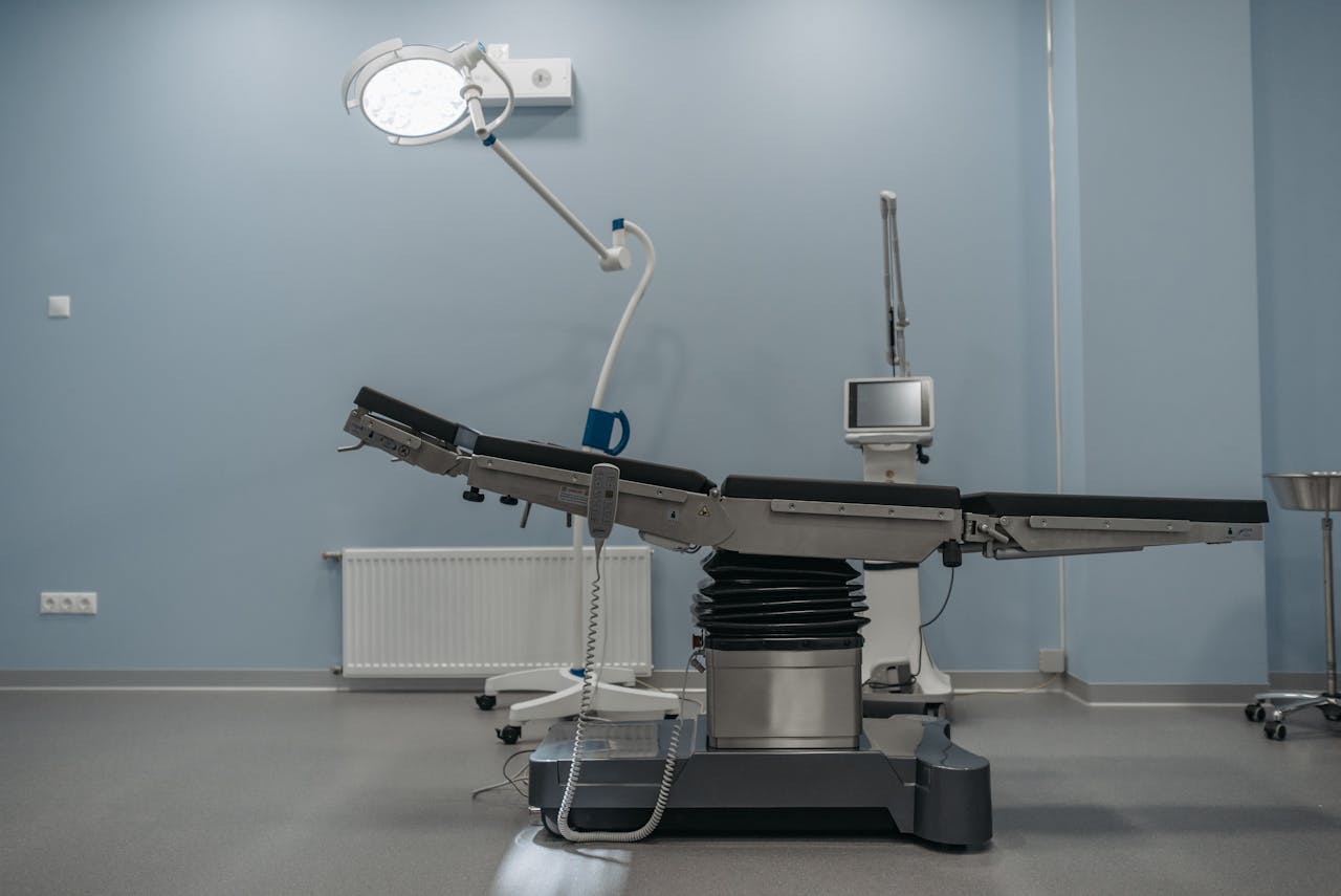 A contemporary operating room showcasing state-of-the-art medical equipment and surgical table.